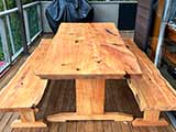 Our kitset table and bench seat frame supporting natural edge slab tops